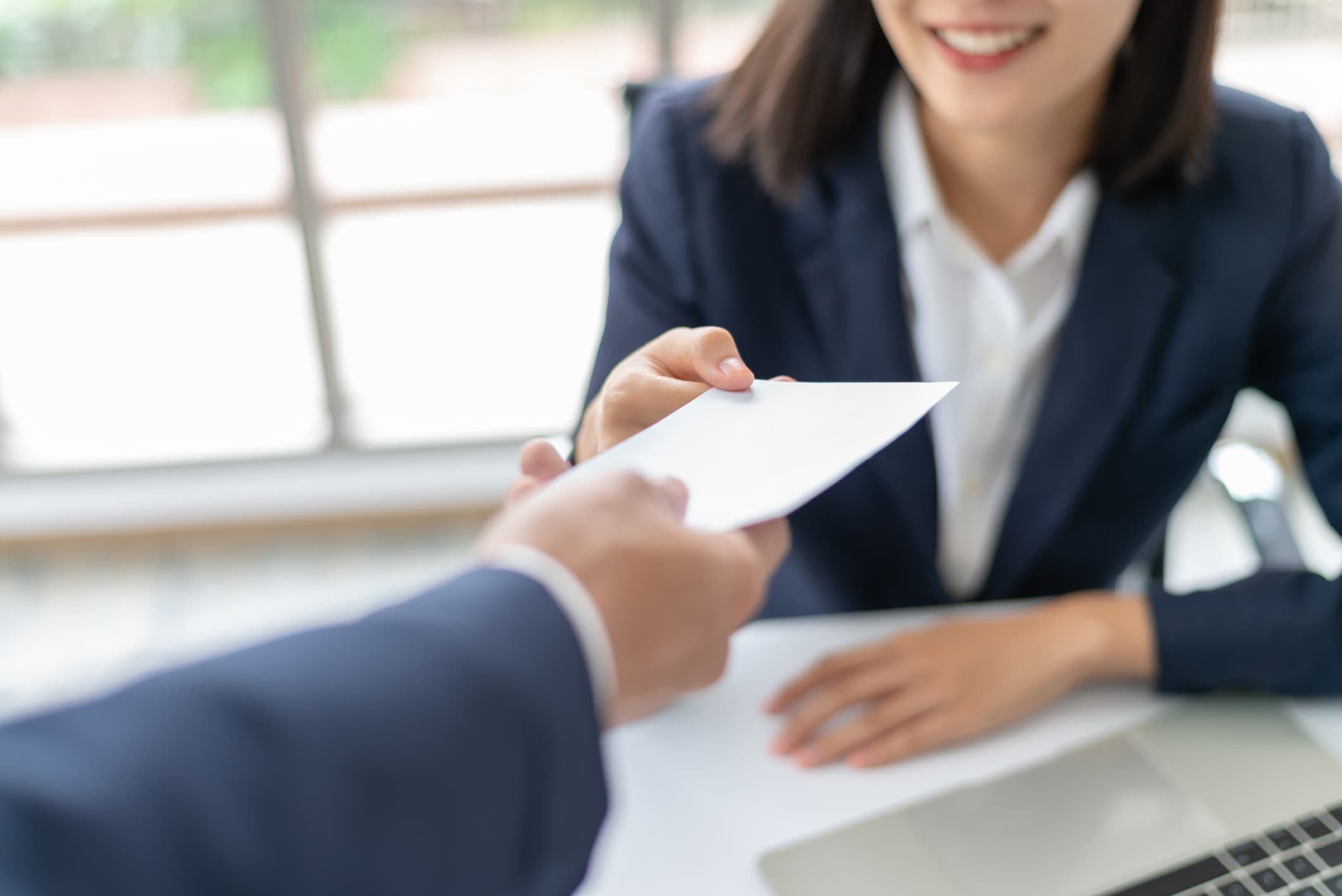 Businesswoman receiving a paycheck